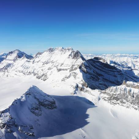 Alpine Glacier Lake with SnowCapped Peaks in Switzerland