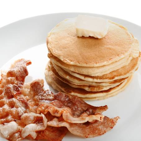 American Pancakes with Syrup and Butter on Clean White Plate