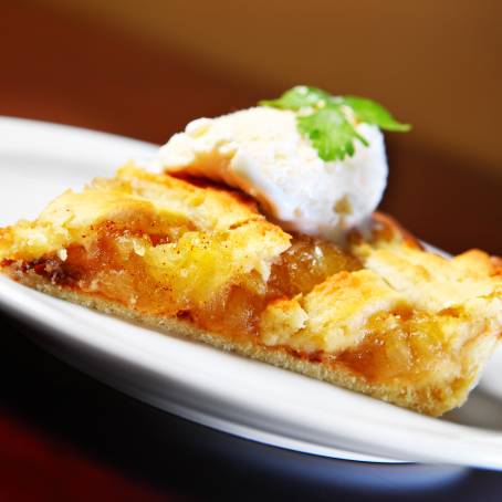 Apple Pie Slice with Vanilla Ice Cream Isolated on White