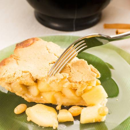 Apple Pie Slice with Vanilla Ice Cream on White Plate