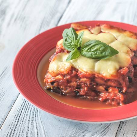 Baked Eggplant Parmigiana di Melanzane with Cheese, Tomatoes, and Spices, Traditional Italian