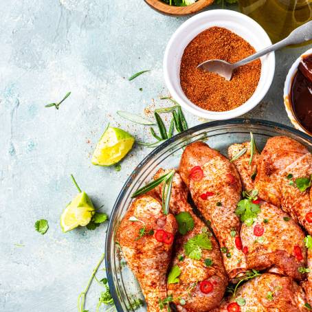 BBQ Chicken Drumsticks with Spices and Herbs Floating, Spicy Grilled Legs with Vegetables