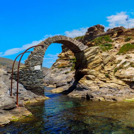 Beautiful Sunrise Over Ancient Stone Bridge and Andros Castle, Greece