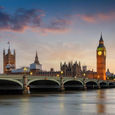 Big Ben and Westminster Palace along the Thames River at Dusk