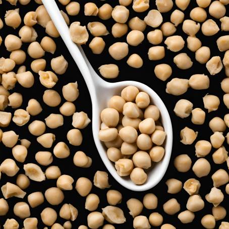 Black Background with White Ceramic Spoon Full of Chickpeas Detailed Isolated Food Photography