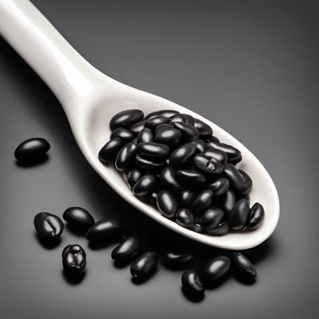 Black Beans in White Ceramic Spoon Isolated on Dark Background Close Up High Contrast Food Image