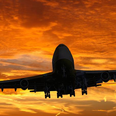 Blue Sunset Sky with Plane Silhouette