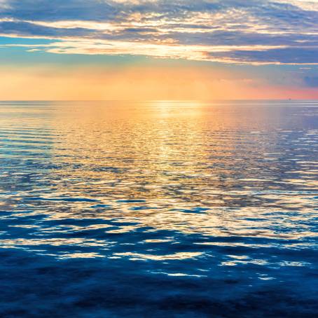 Calm Sea and Cloudy Skies with Gentle Ocean Waves