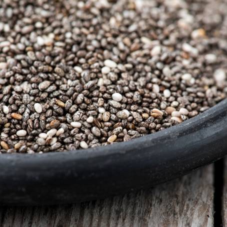 Chia Seeds in a Wooden Spoon Highlighting Antioxidants on a Natural Surface