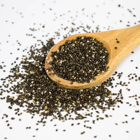 Chia Seeds in a Wooden Spoon with Antioxidants and Essential Nutrients