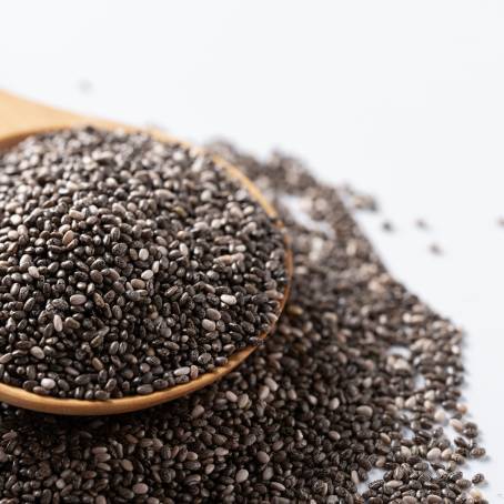 Chia Seeds in a Wooden Spoon with Nutritional Benefits on a Textured Surface