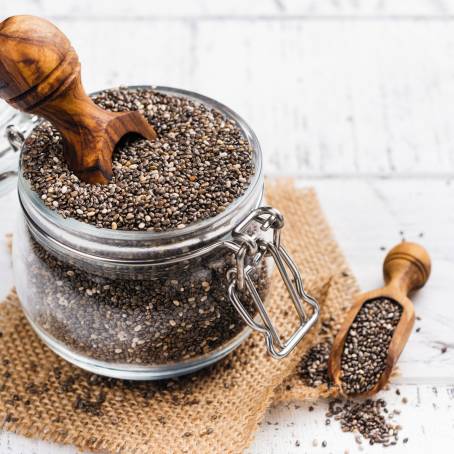 Chia Seeds on a Wooden Spoon with a Light Kitchen Background