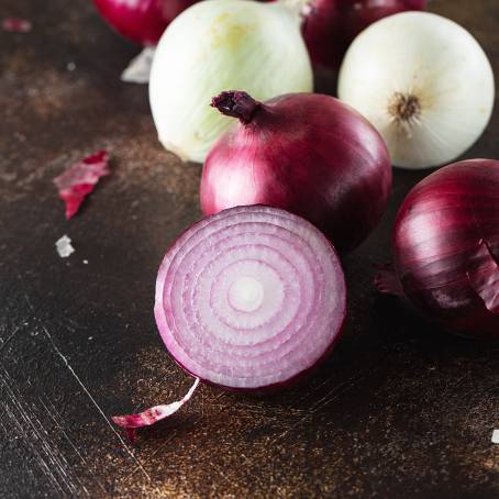 Chopped Red Onion Rings on a Modern Slate Plate with Fresh Herbs