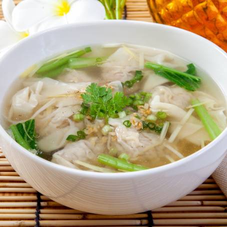 Classic Chicken Broth from Noodle Soup Isolated on White, Comfort Food, Savory and Homemade