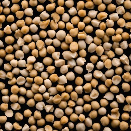 Close Up of Chickpeas in White Ceramic Spoon Against Black Background Isolated Food Image