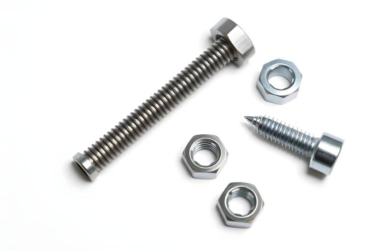 Close Up of Metal Screw and Nuts Isolated on White Durable Hardware for Repairs