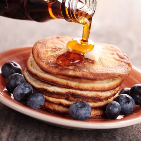 Close Up of Pancakes Drizzled with Honey