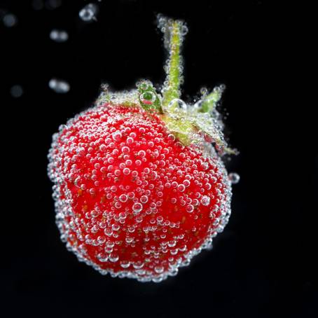 Close Up of Strawberry in Sparkling Water with Bubbles