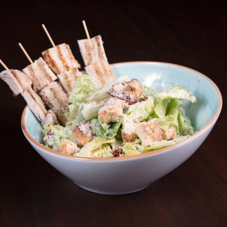 Closeup of Chicken Salad with Juicy Tomatoes and Fresh Greens