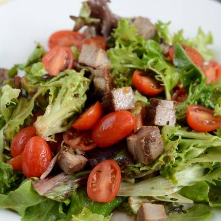 Closeup of Chicken Salad with Ripe Tomatoes