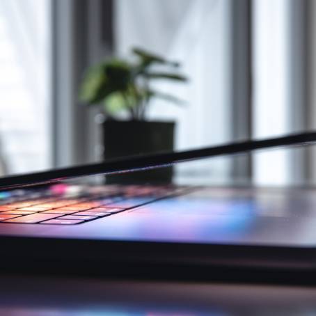 CloseUp of Laptop Keyboard with Neon Backlight