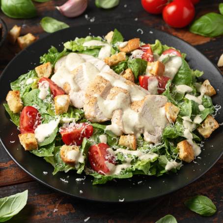 Closeup of Savory Chicken Salad with Cherry Tomatoes and Greens