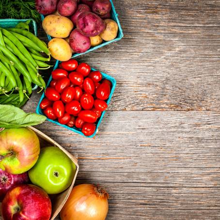 Colorful Fruits and Vegetables Displayed in a Wooden Crate