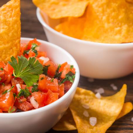 Corn Tortilla Chips with Tomato Salsa in Serving Bowl