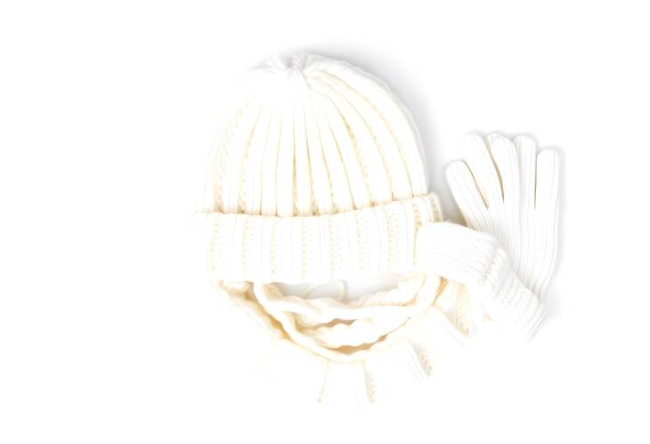 Cozy White Knitted Hat, Scarf, and Gloves Isolated on White Background Winter Essentials