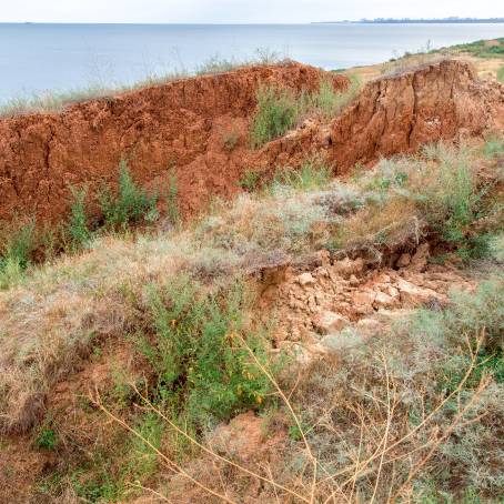 Cracked Roads and Eroded Cliffside Due to Landslide