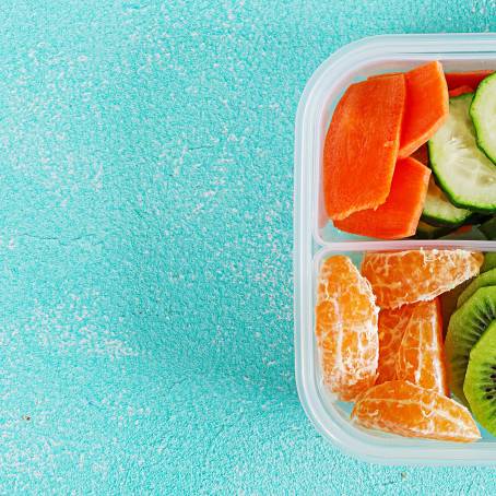 Creative Lunch Box with Sandwich, Carrots, and Mixed Greens Salad Tags