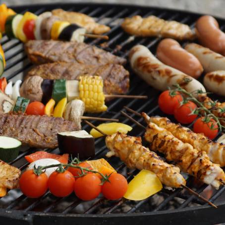 Delicious Grilled Sausage with Rosemary on Hot BBQ Plate  Savory Meal