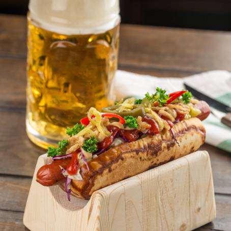 Delicious Hot Dog with Mustard, Ketchup, and a Cold Beer