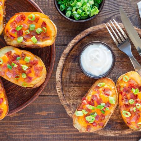 Delicious Loaded Potato Skins with Cheese on Platter