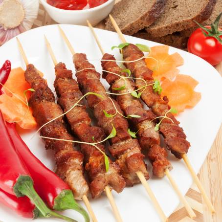 Delicious Shish Kebab Pieces with Fresh Salad on White Plate Perfect for a Healthy Diet