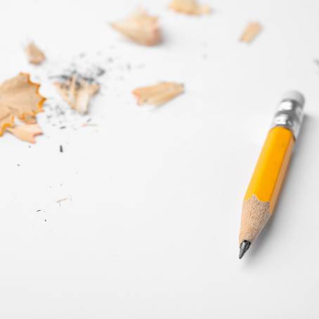 Detailed CloseUp of Broken Wooden Pencil Tip and Graphite on Red Background