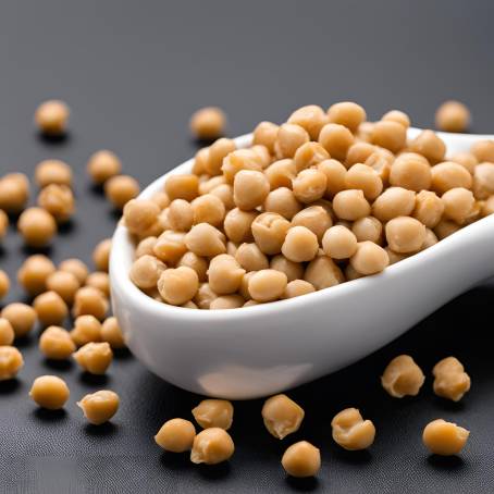 Detailed Food Shot of Chickpeas in White Ceramic Spoon on Black Background Isolated Close Up