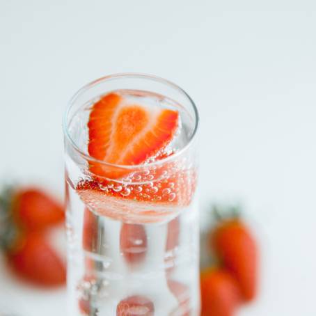 Detailed Strawberry in Sparkling Water with Bubbles Close Up