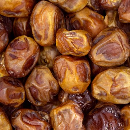 Dried Dates Pile on a White Background