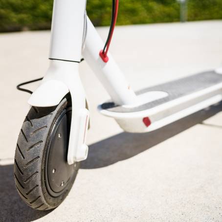 Eco Urban Commute CloseUp of Electric Scooter in the City