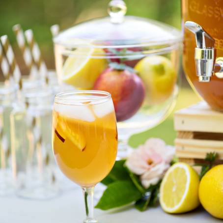 Elegant Peach Lemonade Bottles at Outdoor Party Station