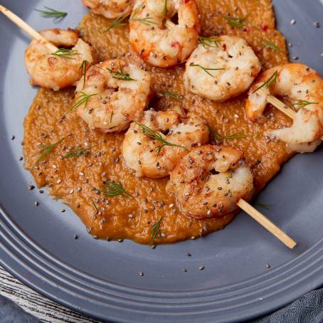 Elegant Top View of Grilled Prawns on Black Plate Perfect for Culinary Displays