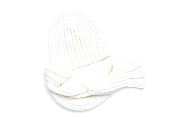 Elegant White Knitted Hat, Scarf, and Gloves Set Isolated on White Background Winter Warmth