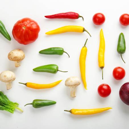 Falling Fresh Vegetables on White Background