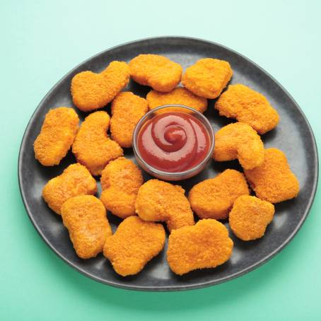 Falling Nuggets with Crispy Texture on White Plate