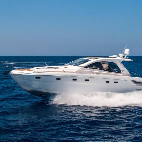 Fast Motorboat Skimming Across Calm Ocean