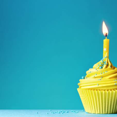 Festive Blue Birthday Cake with Yellow Candles