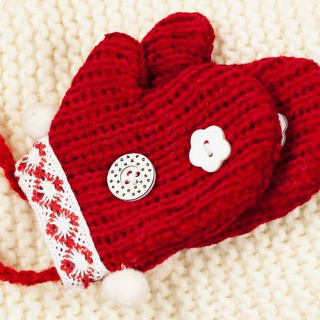 Festive Red Knitted Mittens with Christmas Pattern Isolated Pair on White Background