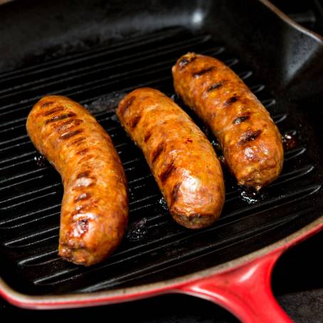 Flavorful Italian Sausage with Cheese and Herbs in a Cast Iron Pan