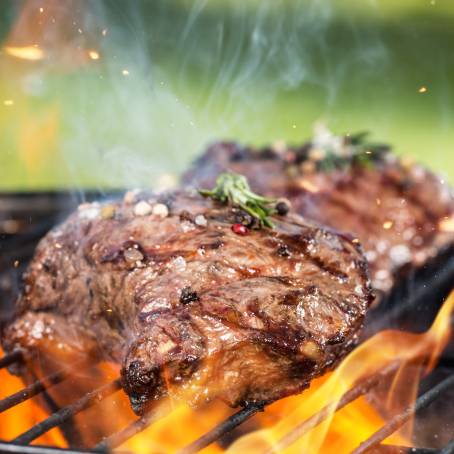 Flying Beef Steaks Delicious Barbecue Meat in Motion, Fast Food Concept, Isolated Background